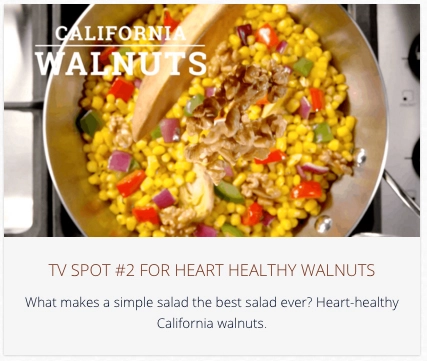 California walnuts stir into a a cooking pan with other ingredients