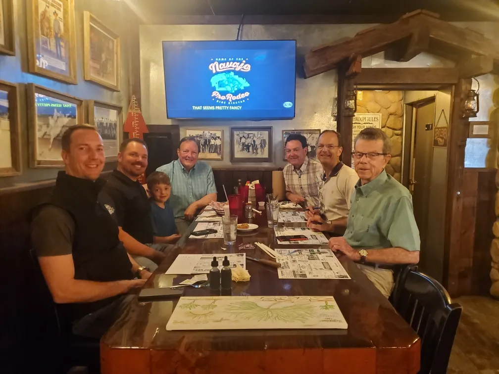 Group photo around dinning table